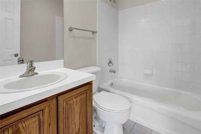 full bathroom featuring toilet, vanity, tile patterned floors, and tiled shower / bath combo