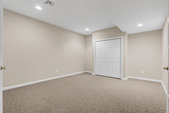 unfurnished bedroom with carpet floors and a closet