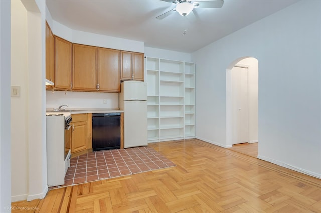 kitchen with white appliances, light parquet floors, ceiling fan, and sink