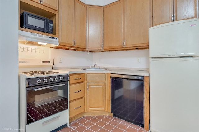 kitchen featuring sink, tile patterned floors, extractor fan, light brown cabinetry, and black appliances