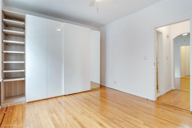 unfurnished bedroom featuring light hardwood / wood-style floors and ceiling fan