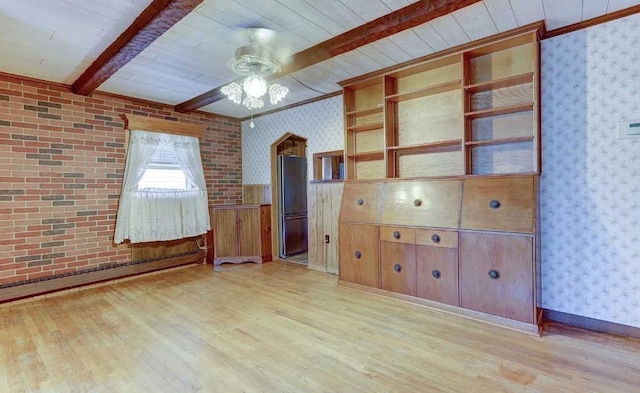 interior space with baseboard heating, ceiling fan, light hardwood / wood-style flooring, and beamed ceiling