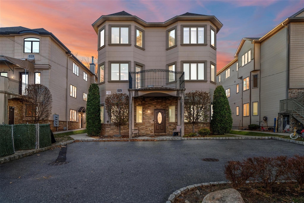 view of front of property with a balcony