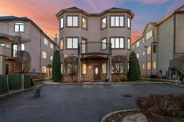 view of front of property with a balcony