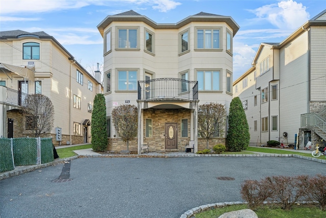 view of front of property with a balcony