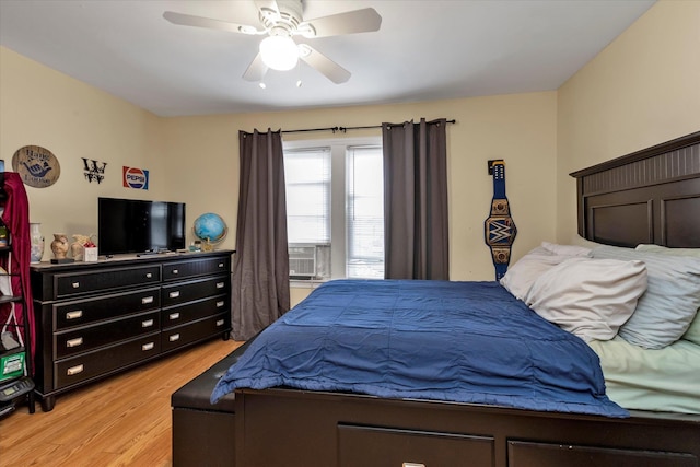 bedroom featuring light hardwood / wood-style flooring and ceiling fan