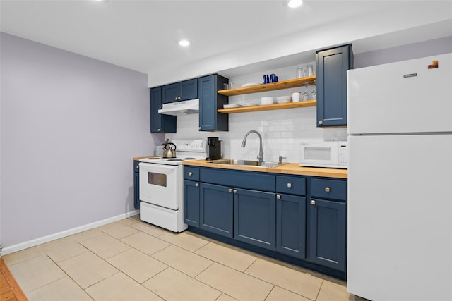 kitchen featuring white appliances, backsplash, blue cabinets, and sink