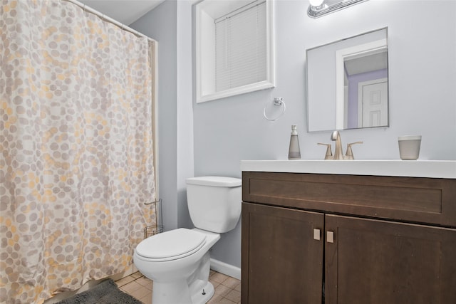 bathroom with tile patterned flooring, vanity, toilet, and a shower with shower curtain