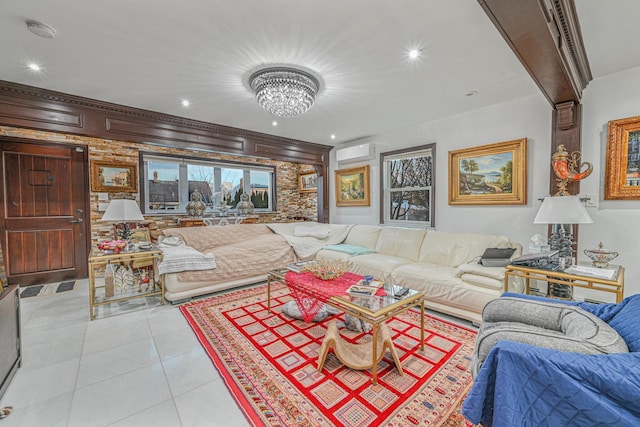 living room with an AC wall unit, light tile patterned flooring, and a chandelier