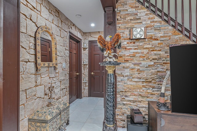 corridor with light tile patterned flooring