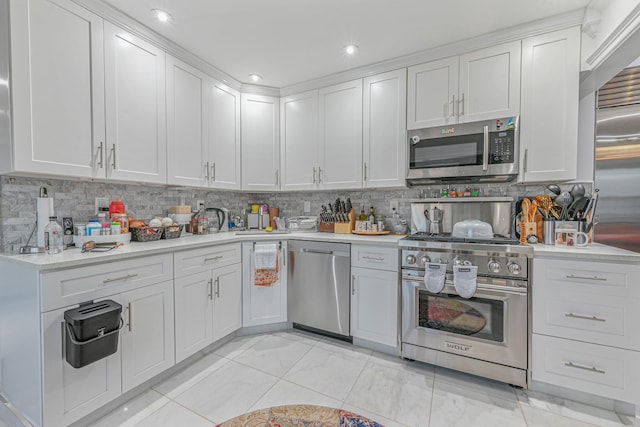 kitchen featuring white cabinets, backsplash, and stainless steel appliances