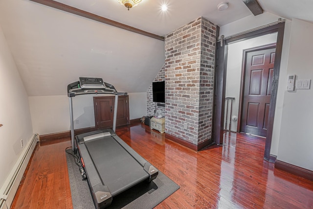 exercise room featuring dark hardwood / wood-style flooring, lofted ceiling, and a baseboard heating unit