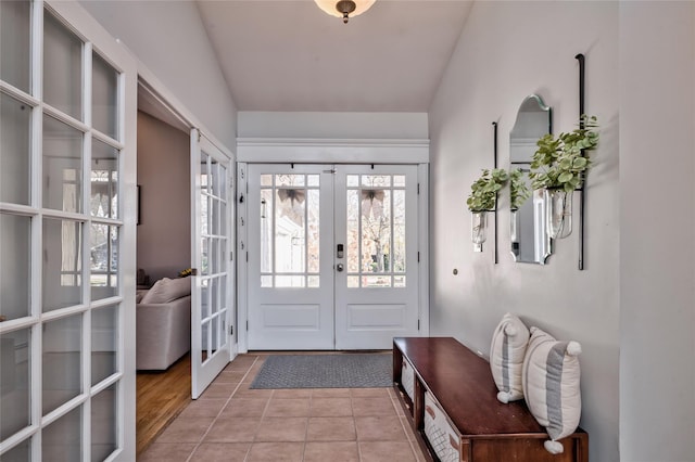 tiled entrance foyer featuring french doors