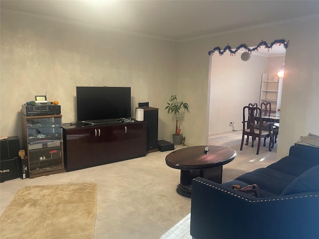 carpeted living room featuring ornamental molding