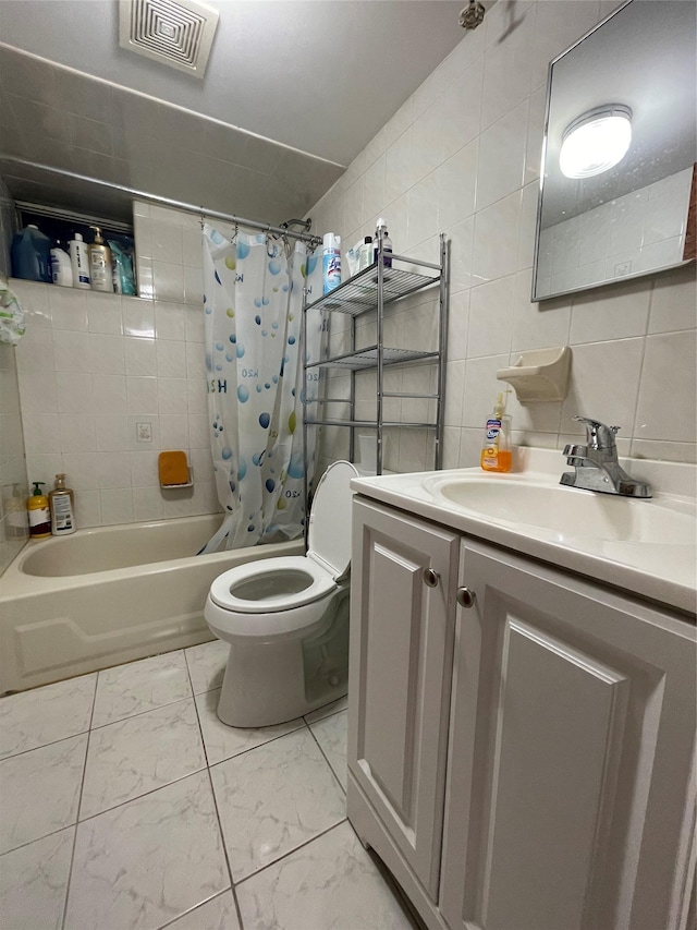 full bathroom with tasteful backsplash, vanity, shower / tub combo with curtain, tile walls, and toilet