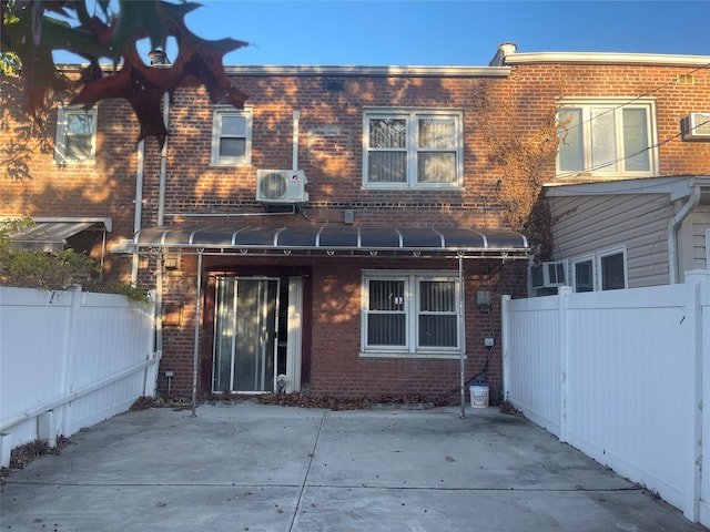 back of house featuring a patio area and ac unit