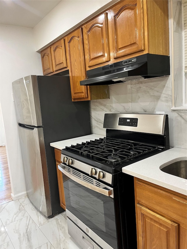 kitchen featuring backsplash and stainless steel appliances