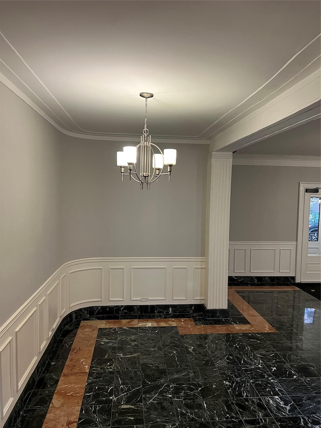 unfurnished dining area featuring an inviting chandelier and ornamental molding