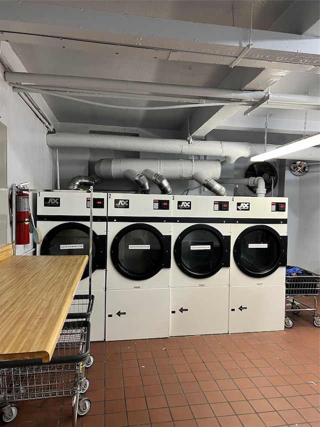 washroom with washing machine and clothes dryer