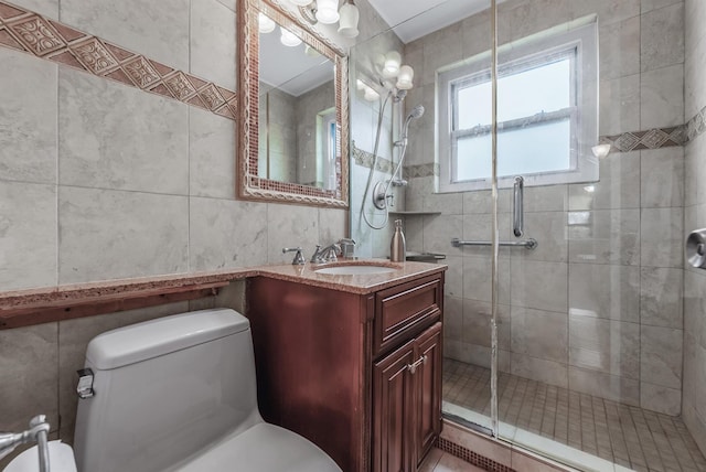 bathroom featuring vanity, an enclosed shower, tile walls, and toilet