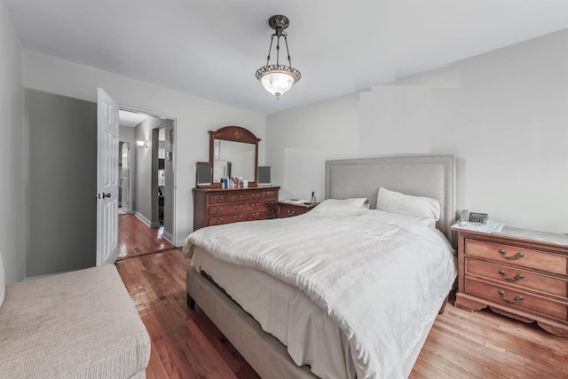 bedroom with hardwood / wood-style floors