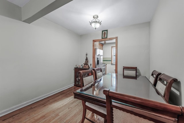 dining space featuring light wood-type flooring