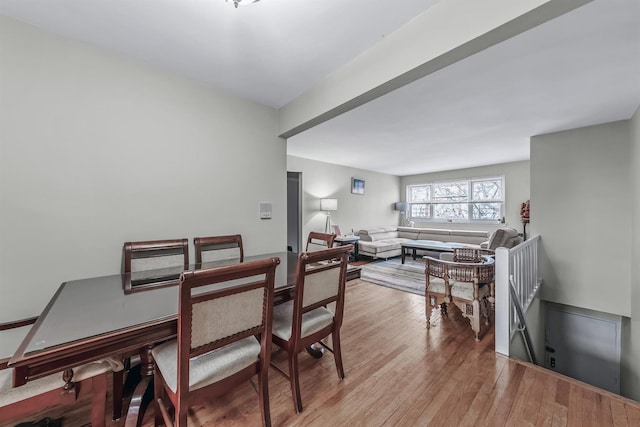 dining space with light hardwood / wood-style flooring