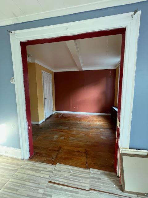 817 Southard St, Baldwin, NY 11510 - hall with wood-type flooring and baseboards