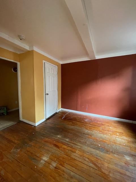 817 Southard St, Baldwin, NY 11510 - empty room with hardwood / wood-style floors and baseboards