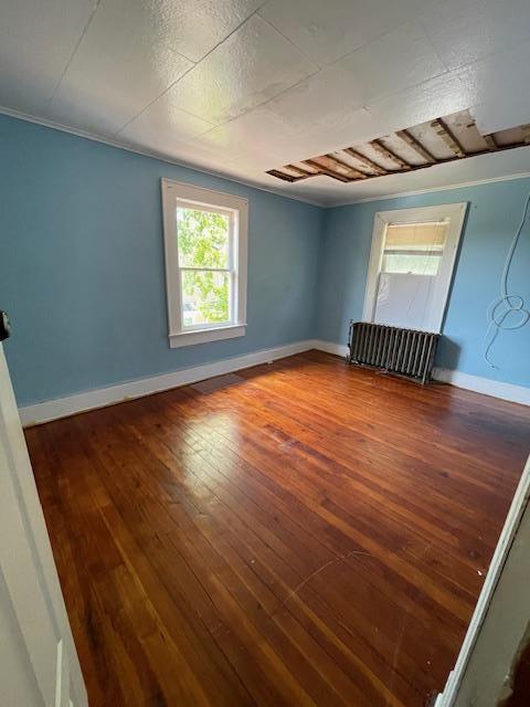 817 Southard St, Baldwin, NY 11510 - empty room featuring hardwood / wood-style flooring and baseboards