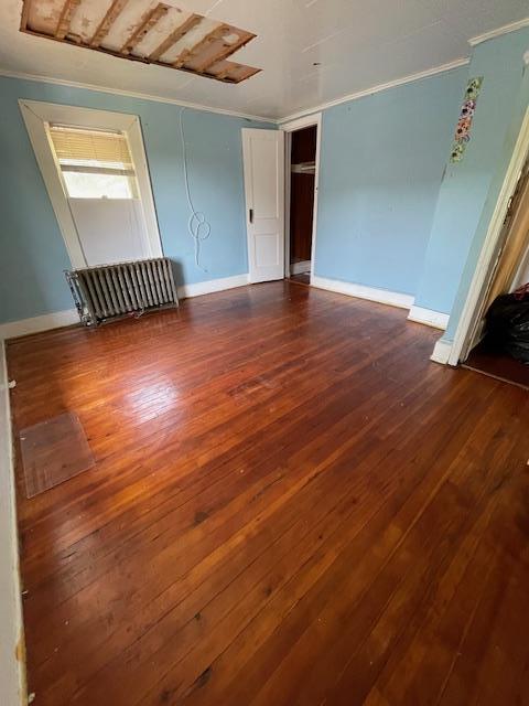 817 Southard St, Baldwin, NY 11510 - spare room featuring crown molding, dark wood finished floors, and baseboards
