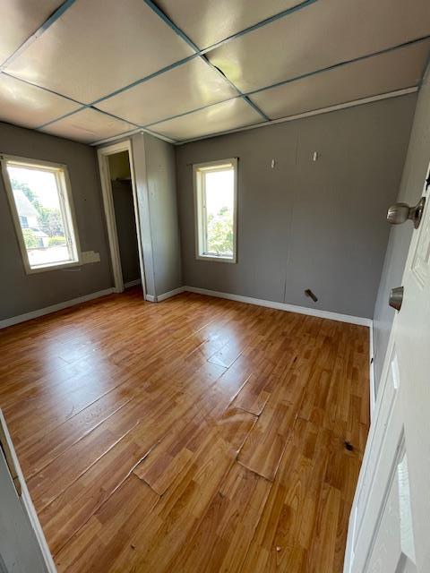 817 Southard St, Baldwin, NY 11510 - unfurnished room featuring wood finished floors and baseboards