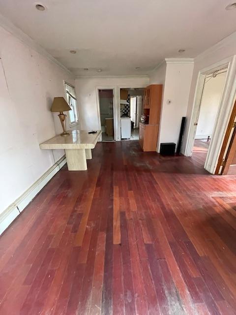 817 Southard St, Baldwin, NY 11510 - hallway featuring dark wood-type flooring and crown molding