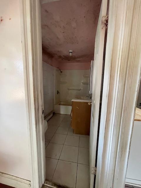 817 Southard St, Baldwin, NY 11510 - bathroom with tile patterned floors, vanity, and toilet
