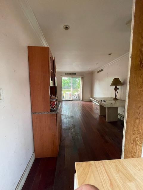 817 Southard St, Baldwin, NY 11510 - hall featuring dark wood finished floors and baseboards