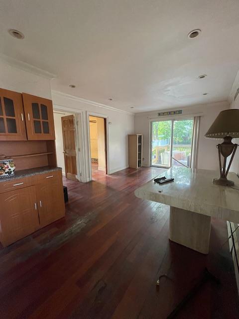 817 Southard St, Baldwin, NY 11510 - living room featuring dark wood finished floors, ornamental molding, and recessed lighting
