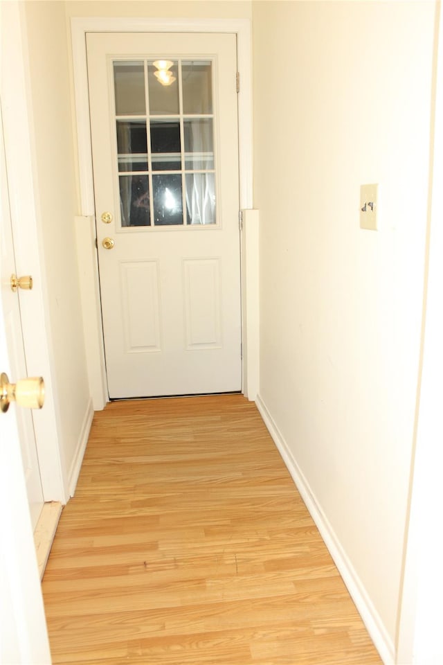 doorway to outside with light hardwood / wood-style flooring