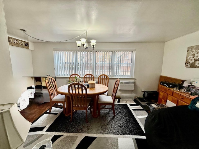 dining space featuring a chandelier, a wall mounted AC, and a healthy amount of sunlight