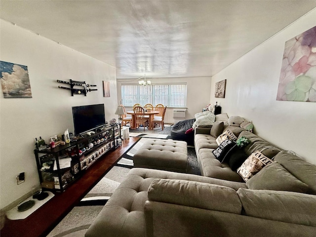 living room with wood-type flooring and an inviting chandelier