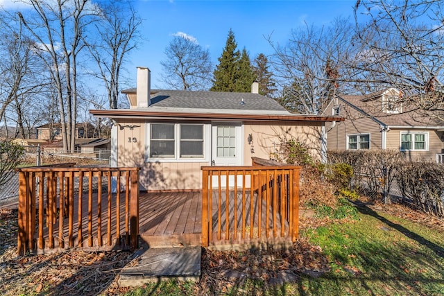 back of house featuring a deck