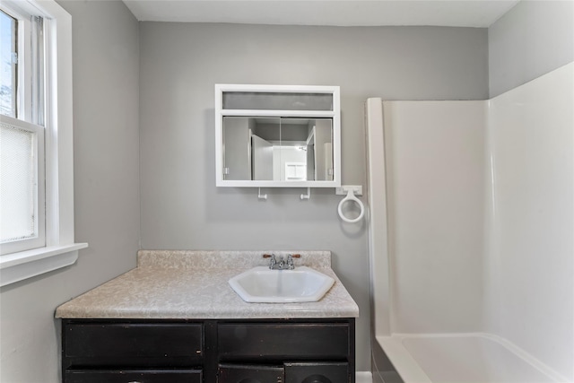 bathroom with bathing tub / shower combination and vanity