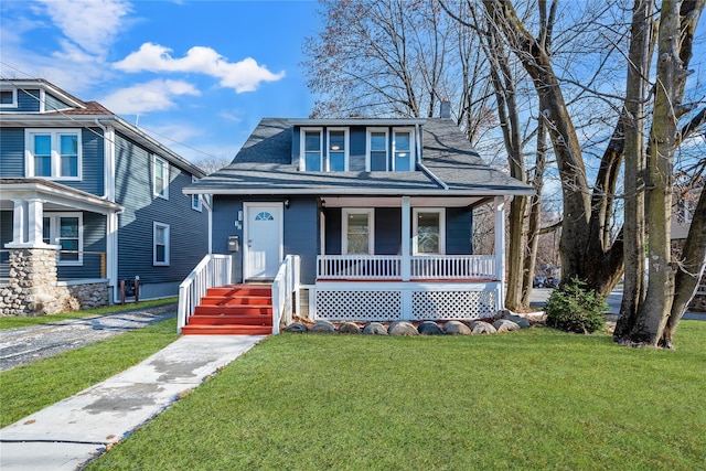 bungalow-style home with a porch and a front yard