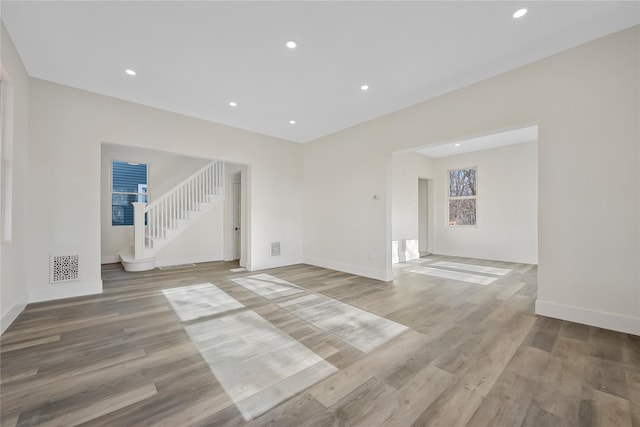 unfurnished living room with light hardwood / wood-style flooring