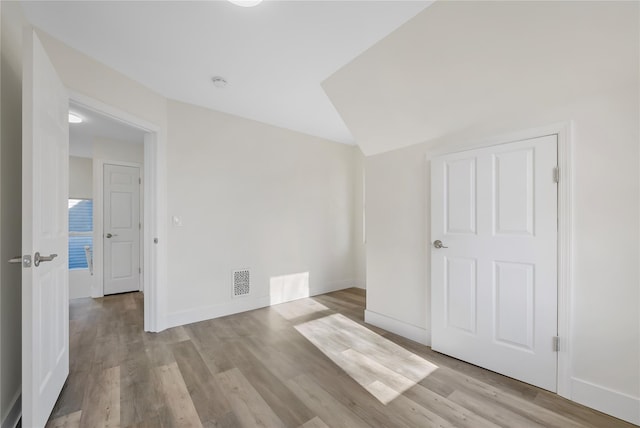 unfurnished room with light hardwood / wood-style floors