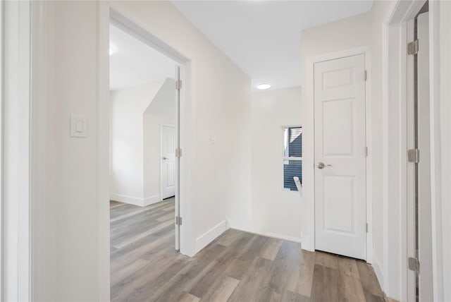 hallway with light wood-type flooring