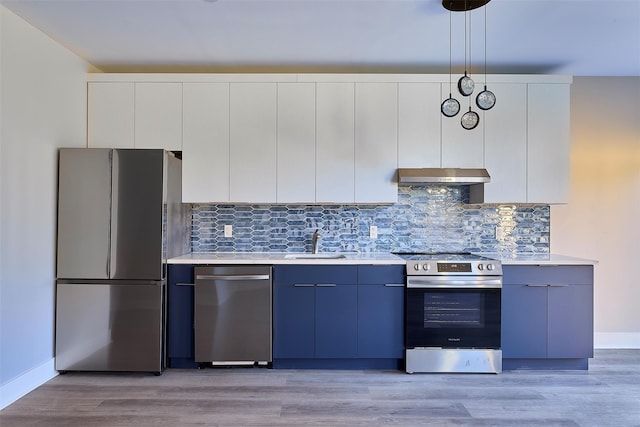 kitchen featuring white cabinets, hanging light fixtures, sink, blue cabinetry, and appliances with stainless steel finishes