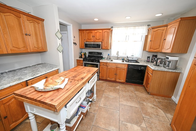 651 Madison Ave, Lindenhurst, NY 11757 - kitchen featuring stainless steel appliances, butcher block countertops, brown cabinetry, and recessed lighting