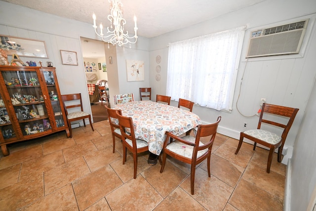 651 Madison Ave, Lindenhurst, NY 11757 - dining area featuring a wall mounted AC, a chandelier, and a textured ceiling
