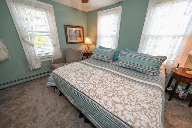 651 Madison Ave, Lindenhurst, NY 11757 - carpeted bedroom featuring multiple windows and a baseboard radiator