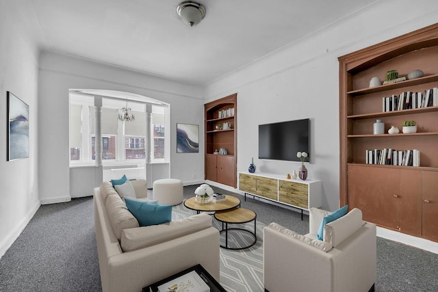 living room with carpet flooring, a notable chandelier, and built in features